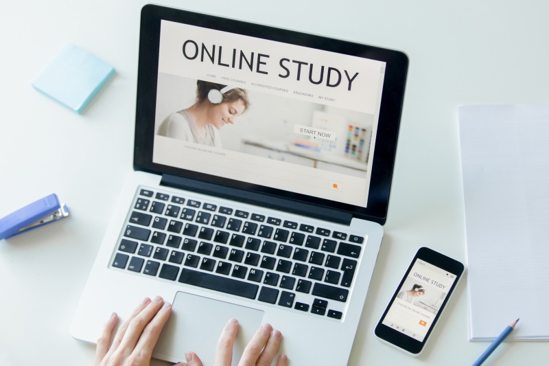 hands-working-with-laptop-title-online-study-screen